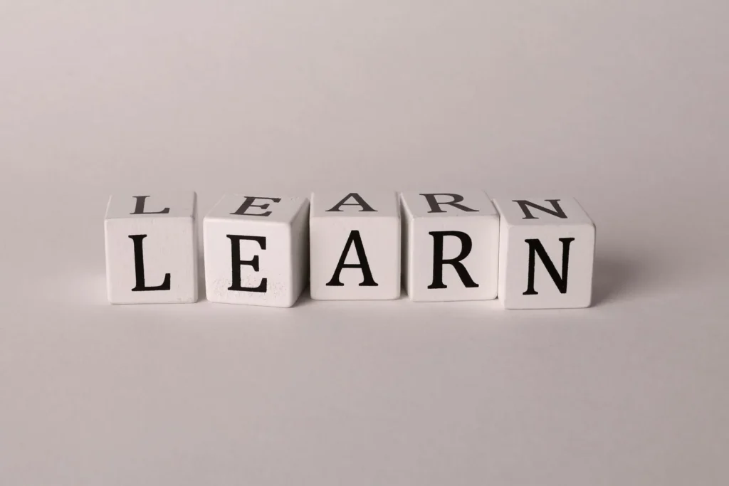 White letter blocks spelling LEARN, symbolizing the Russian learning journey
